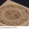 gravure sur une boîte bois d'une rose des vents, fabrication artisanale